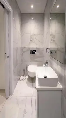 a white bathroom with a sink and a toilet at City Napa Seaview Villas - Villa 4 in Ayia Napa