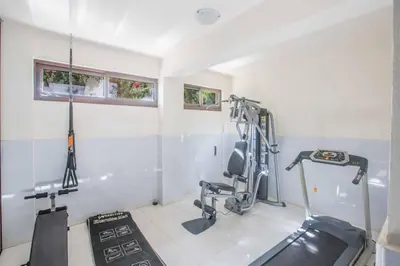a room with a gym with a treadmill and weights at Protaras Demetra Villa DE1 in Protaras