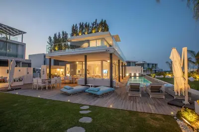 a large house with a patio and a pool at Olivine Pearl OL3 in Protaras
