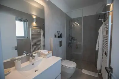 a bathroom with a sink and a toilet and a shower at Olivine Pearl OL3 in Protaras
