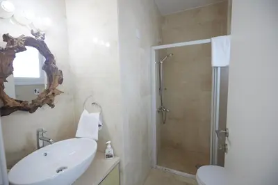 a bathroom with a white sink and a shower at Serifos Villa 7 - 100 meters from Malama Beach in Protaras