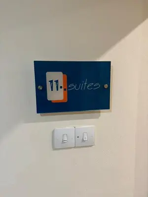 a blue sign on a wall with a switch at 11 Suites - Sunrise Horizon Suite in Larnaka
