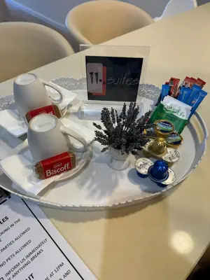 a plate with candles and other items on a table at 11 Suites - Sunrise Horizon Suite in Larnaka