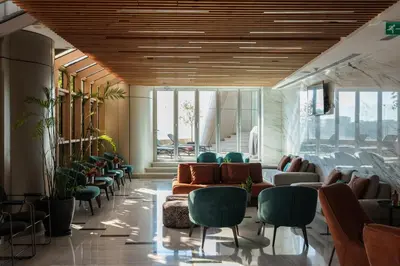 a waiting room with couches and chairs in a building at 360 Nicosia Heights, Gym & Pool in Nicosia