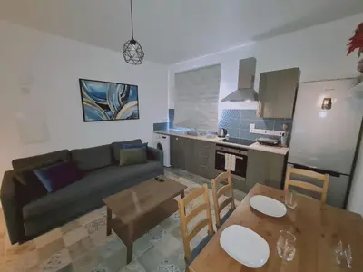 a living room with a couch and a table at STAY Kallipoleos Apartment in Nicosia