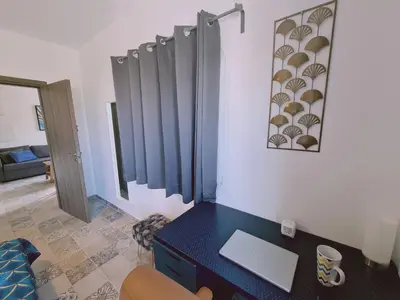 a room with a desk with a laptop on it at STAY Kallipoleos Apartment in Nicosia