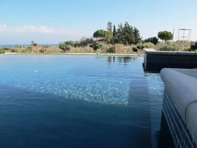 a large body of water with a pool of water at Villa Olivo Maroni in Maroni
