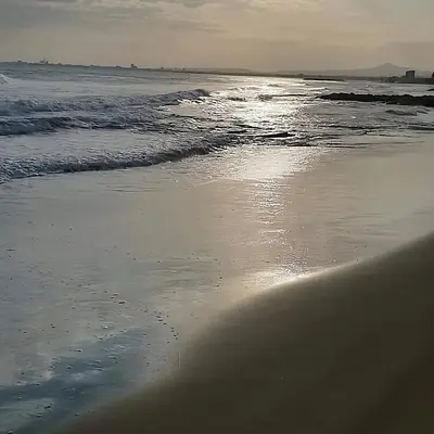 a beach with the ocean and the shoreline at Sea Heart Villa Beachfront in Pyla