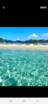 a view of a beach from the water at Luxury Cozy Apartment near NISSI BEACH in Ayia Napa