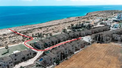 an aerial view of a resort near the ocean at WealthyStays Sunset Villa, 3min walk to Sea in Paralimni