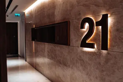 a number sign on a wall in a hallway at SkyHigh Central 360 Gym & Pool in Nicosia