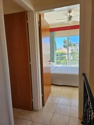 a door leading to a bedroom with a view of a bed at Villa Penny in Pissouri