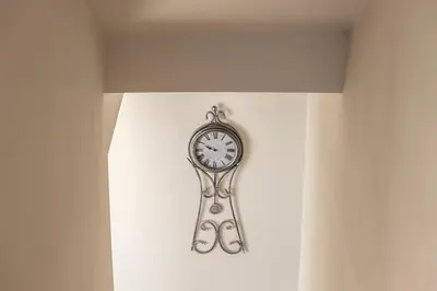 a clock is hanging on a wall at Protaras Hestia Seaside Villa B6 in Protaras