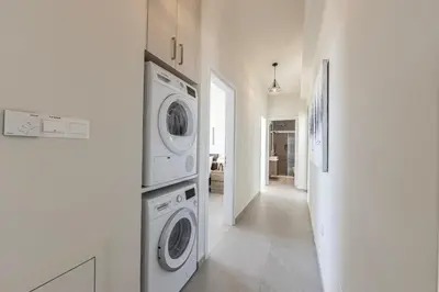a white laundry room with a washer and dryer at Protaras Hestia Seaside Villa B6 in Protaras