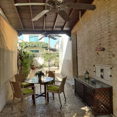 an outdoor patio with a table and chairs at Quiet holiday house near the beach in Meneou