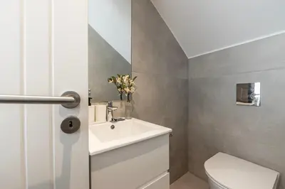 a bathroom with a white sink and a toilet at Protaras By the Bay Villa 33 in Protaras