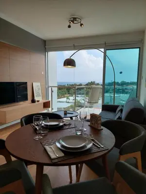 a dining room table with wine glasses on it at Milepost vacations in Paralimni