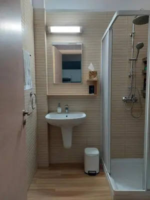 a bathroom with a sink and a shower at Milepost vacations in Paralimni