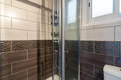 a bathroom with a glass shower with a toilet at Jayde 2-Bedroom Apartment in Larnaca in Larnaka
