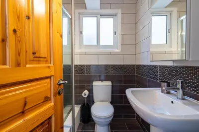 a bathroom with a toilet and a sink at Jayde 2-Bedroom Apartment in Larnaca in Larnaka