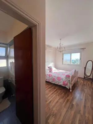 a bedroom with a bed and a window at ROSE VILLA - 3 BED POOL in Episkopi Lemesou