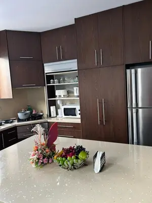 a kitchen with a bowl of fruit on a counter at DAFNI VILLA BY PANN in Protaras