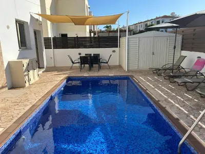 a swimming pool in the backyard of a house at DAFNI VILLA BY PANN in Protaras