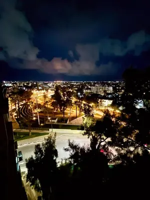 a view of a city at night with lights at Nicolas 1 in Larnaka