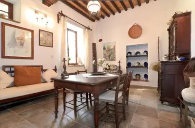 a living room with a table and a couch at Historical House in the Old City of Nicosia in Nicosia