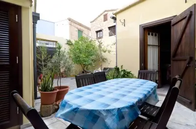 a patio with a table and chairs on a patio at Historical House in the Old City of Nicosia in Nicosia