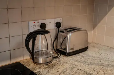 a kitchen counter with a toaster and a toaster at Amazing Sea and Marina View City Center 2BDR Flat in Larnaka