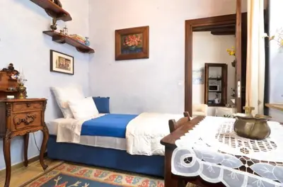 a bedroom with a bed and a table in it at Studio in the Old City of Nicosia in Nicosia