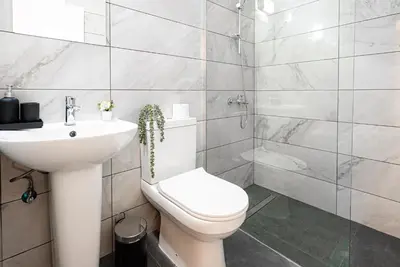 a bathroom with a toilet and a sink and a shower at COZY Apartment In Kapparis #2 in Paralimni