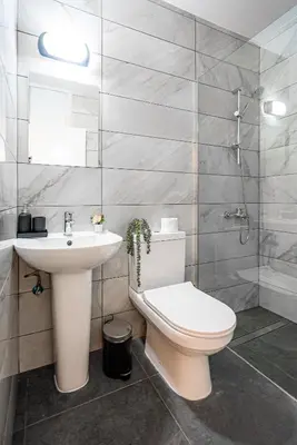 a bathroom with a toilet and a sink at COZY Apartment In Kapparis #2 in Paralimni