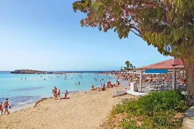 a beach with a lot of people in the water at Villa Napa Blu in Ayia Napa