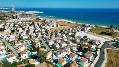 an aerial view of a town next to the ocean at Villa Argyro in Ayia Napa