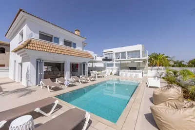 a villa with a swimming pool and a house at SunnyVillas-3BR New Modern Villa-Private Pool-BLG in Paralimni
