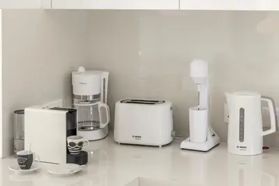 a group of appliances sitting on top of a counter at SunnyVillas-3BR New Modern Villa-Private Pool-BLG in Paralimni