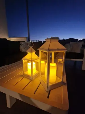 two lanterns sitting on top of a table at MARTIN Nicosia City Suites in Nicosia