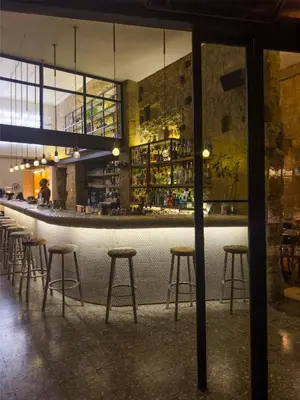 a row of bar stools in a restaurant at MARTIN Nicosia City Suites in Nicosia