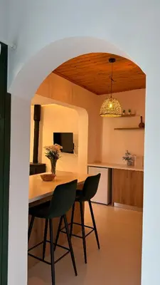 a kitchen and dining room with a table and chairs at Pirella House in Limassol