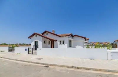 a white house with a white fence at Kymma Villa #5 in Ayia Napa