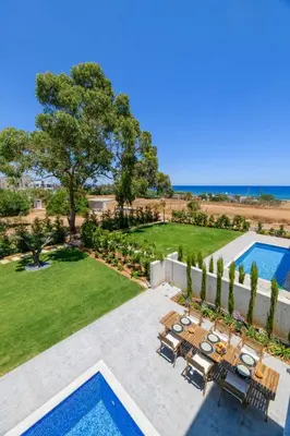 an aerial view of a backyard with a swimming pool at By The Beach - Sea Pearl Villa in Protaras