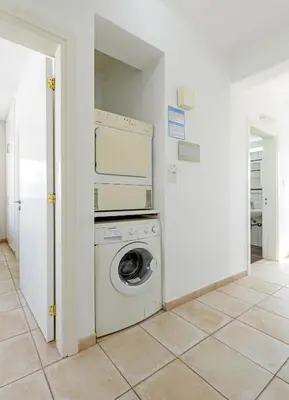 a washer and dryer in a white room at Sunrise Bay Villa #5 in Protaras
