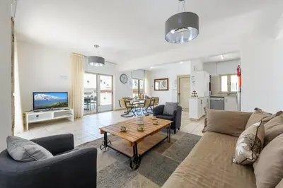 a living room with a couch and a table at Sunrise Bay Villa #5 in Protaras