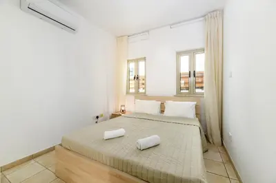 a bedroom with a bed with two towels on it at Sunrise Bay Villa #6 in Protaras