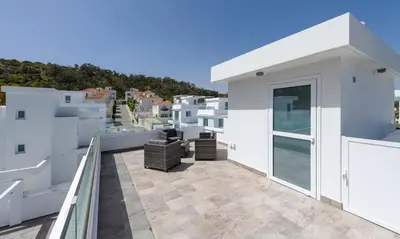 a balcony with a view of a city at Green Bay Villa #15 in Protaras