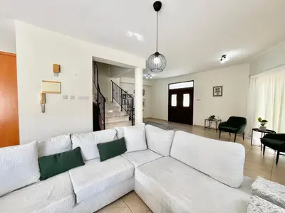 a white living room with a white couch at STAY Tranquility Cove in Larnaka