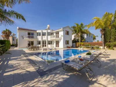 a villa with a swimming pool and a house at Villa Alexandra in Protaras