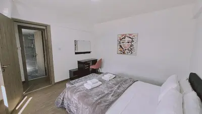 a bedroom with a bed with two towels on it at STAY Blissful Apartment in Protaras